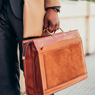 Business,Man,Holding,A,Briefcase.